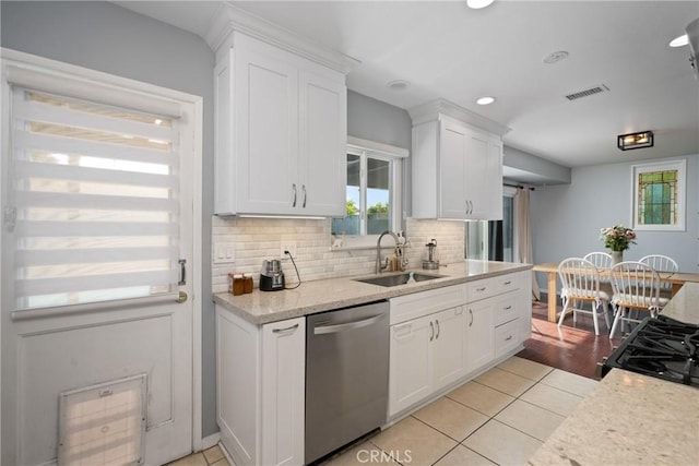 660 N Highland St, Orange, CA 92867 - kitchen featuring dishwasher, light tile patterned floors, white cabinetry, decorative backsplash, and range with gas stovetop