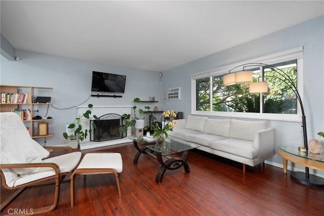 660 N Highland St, Orange, CA 92867 - living area with wood finished floors and a brick fireplace