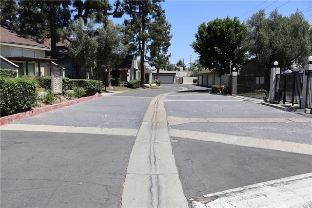 21301 Norwalk Blvd Unit 93, Hawaiian Gardens, CA 90716 - view of asphalt road featuring street lighting, a residential view, and curbs