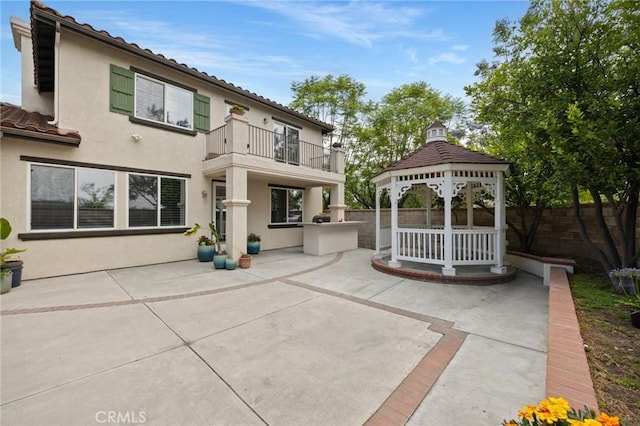 1737 Partridge Ave, Upland, CA 91784 - back of property featuring a balcony, a gazebo, a patio area, and stucco siding