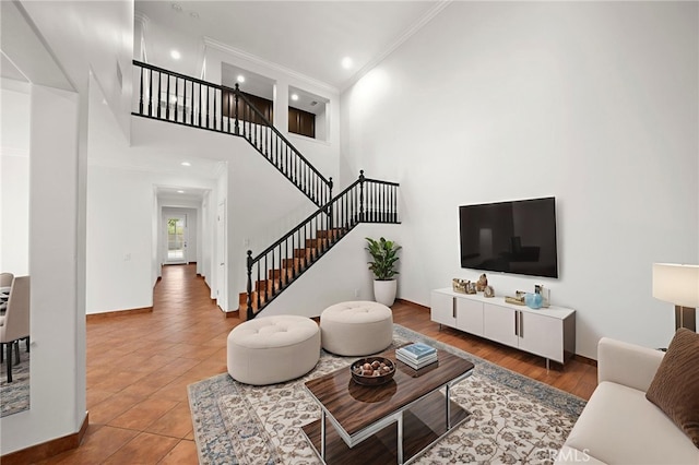 1737 Partridge Ave, Upland, CA 91784 - tiled living room with stairs, ornamental molding, recessed lighting, and a towering ceiling