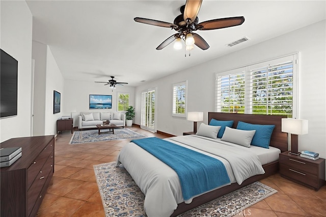 1737 Partridge Ave, Upland, CA 91784 - bedroom with light tile patterned floors, multiple windows, a ceiling fan, and access to exterior