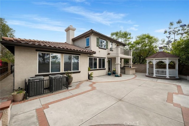 1737 Partridge Ave, Upland, CA 91784 - back of house featuring a gazebo, a balcony, a patio, stucco siding, and a tile roof