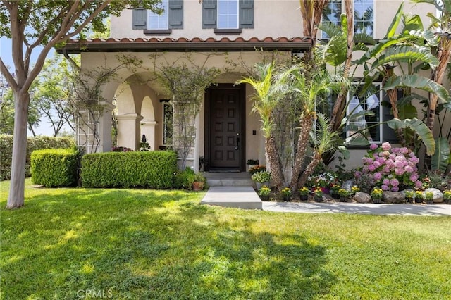 1737 Partridge Ave, Upland, CA 91784 - doorway to property with stucco siding and a yard