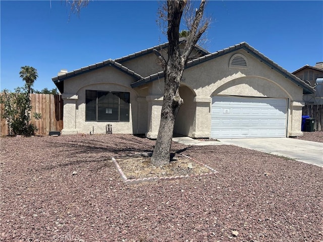 467 Stanford Dr, Barstow, CA 92311 - view of front facade featuring concrete driveway, stucco siding, and an attached garage