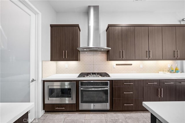 814 Beacon, Irvine, CA 92618 - kitchen featuring appliances with stainless steel finishes, wall chimney range hood, light countertops, and tasteful backsplash