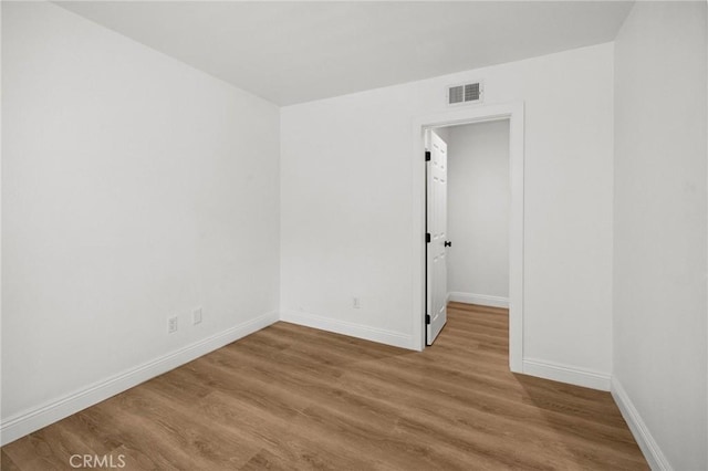 5731 Applecross Dr, Riverside, CA 92507 - spare room featuring baseboards and wood finished floors