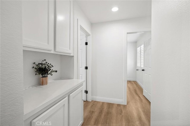 5731 Applecross Dr, Riverside, CA 92507 - corridor with light wood finished floors and recessed lighting