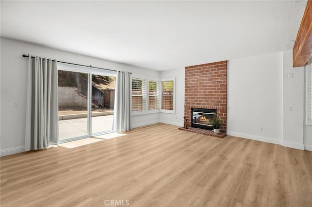 5731 Applecross Dr, Riverside, CA 92507 - unfurnished living room with light wood-type flooring and a fireplace