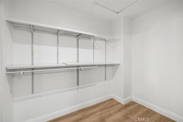 5731 Applecross Dr, Riverside, CA 92507 - walk in closet featuring wood finished floors
