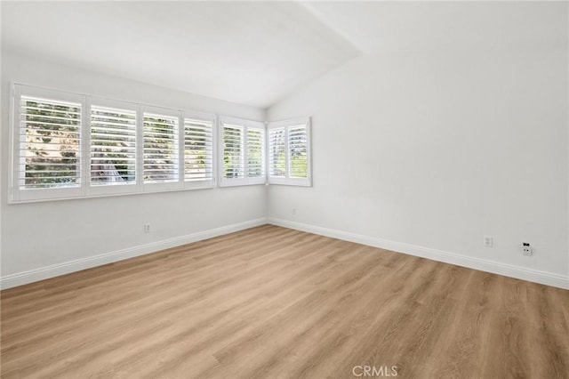 5731 Applecross Dr, Riverside, CA 92507 - spare room featuring lofted ceiling and light wood-style flooring