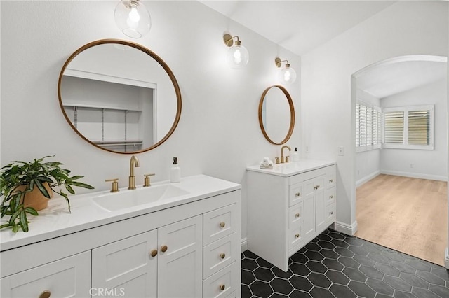 5731 Applecross Dr, Riverside, CA 92507 - bathroom with two vanities, lofted ceiling, and tile patterned flooring
