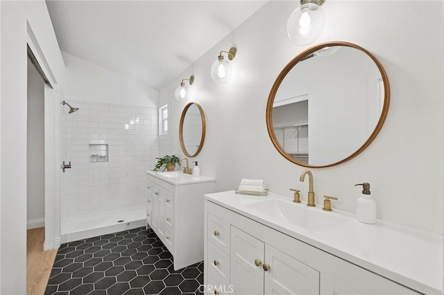 5731 Applecross Dr, Riverside, CA 92507 - full bath featuring two vanities, vaulted ceiling, a tile shower, and tile patterned flooring