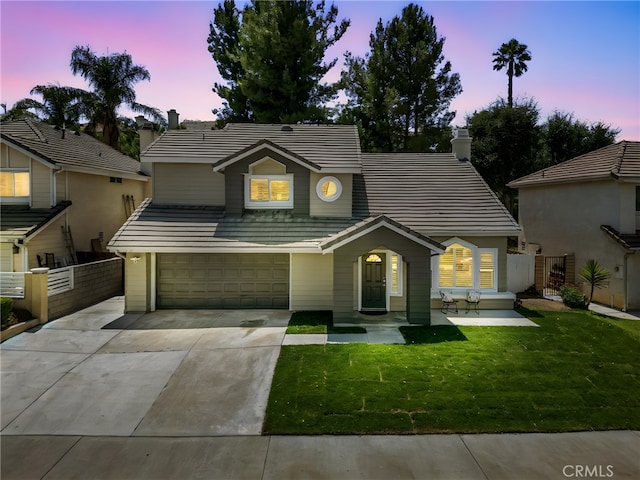 5731 Applecross Dr, Riverside, CA 92507 - view of front of house featuring driveway, a tile roof, an attached garage, and a chimney