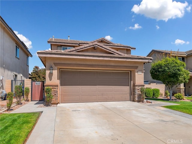 18387 Evening Primrose Ln, San Bernardino, CA 92407 - view of front of property with stone siding, concrete driveway, stucco siding, and a tile roof