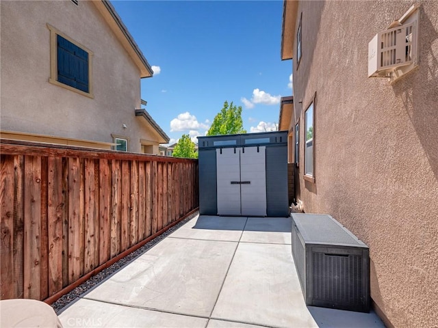 18387 Evening Primrose Ln, San Bernardino, CA 92407 - view of patio featuring a storage shed