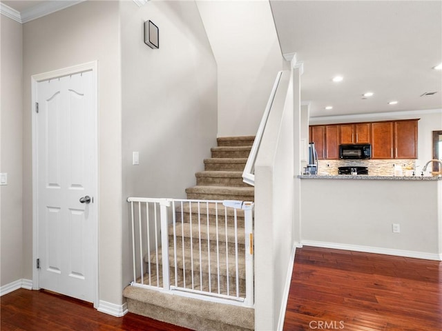 18387 Evening Primrose Ln, San Bernardino, CA 92407 - stairs featuring wood finished floors, crown molding, and recessed lighting