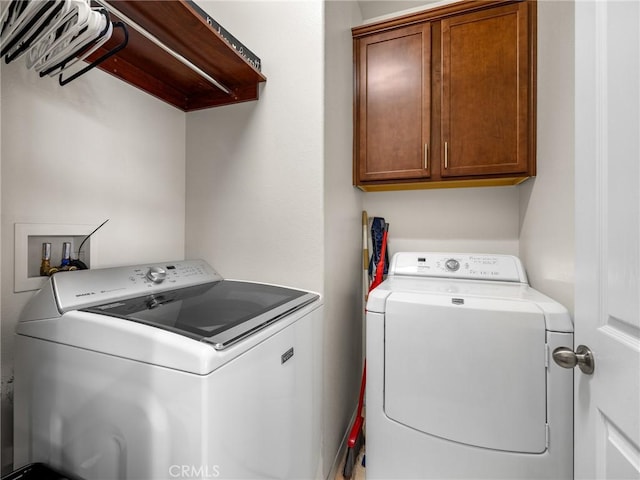 18387 Evening Primrose Ln, San Bernardino, CA 92407 - laundry room featuring washing machine and clothes dryer and cabinet space