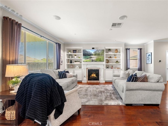 18387 Evening Primrose Ln, San Bernardino, CA 92407 - living area featuring ornamental molding, wood finished floors, a fireplace with flush hearth, and built in features
