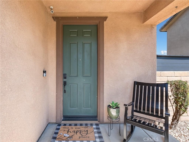 18387 Evening Primrose Ln, San Bernardino, CA 92407 - entrance to property with stucco siding and a surveillance system