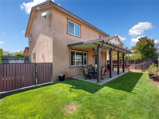 18387 Evening Primrose Ln, San Bernardino, CA 92407 - back of property featuring stucco siding, ceiling fan, a fenced backyard, a patio area, and a pergola