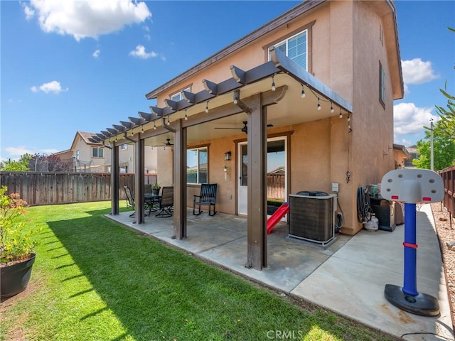 18387 Evening Primrose Ln, San Bernardino, CA 92407 - rear view of house featuring stucco siding, a fenced backyard, a ceiling fan, and a patio