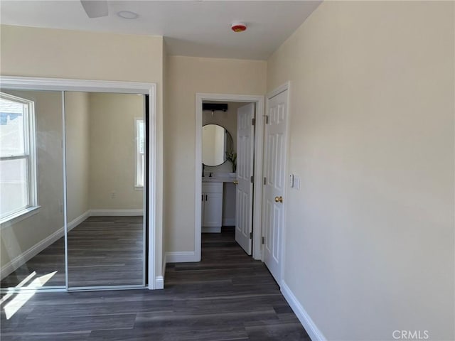 817 Orange Grove Ave, Colton, CA 92324 - unfurnished bedroom featuring multiple windows and wood finished floors
