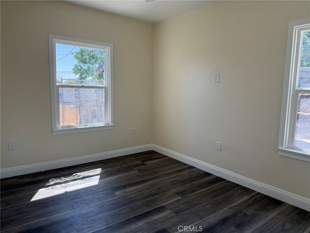 817 Orange Grove Ave, Colton, CA 92324 - spare room featuring dark wood-style floors and healthy amount of natural light