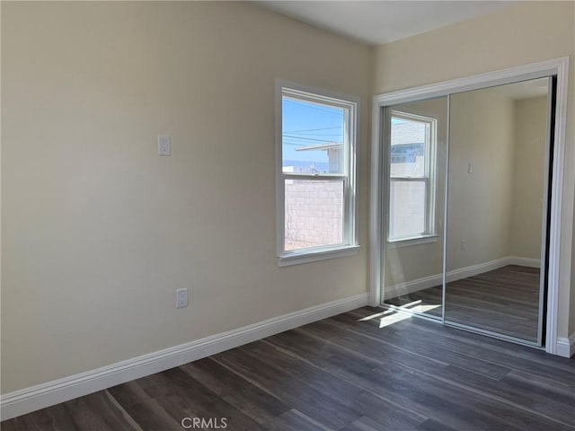 817 Orange Grove Ave, Colton, CA 92324 - unfurnished bedroom featuring dark wood finished floors and a closet