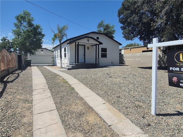 817 Orange Grove Ave, Colton, CA 92324 - view of front of property featuring a detached garage, stucco siding, and an outdoor structure