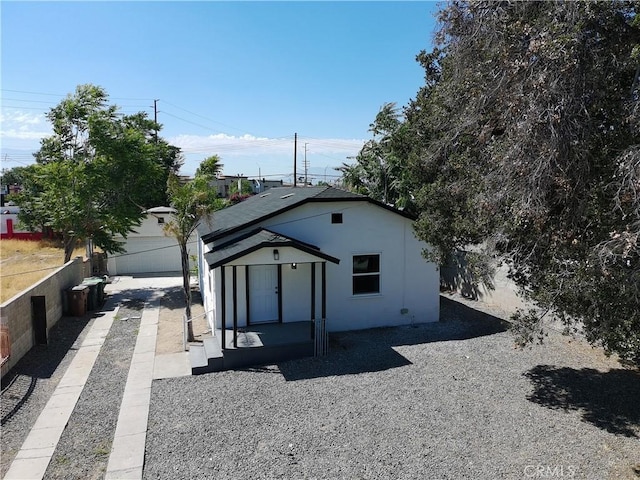 817 Orange Grove Ave, Colton, CA 92324 - back of house featuring an outbuilding and stucco siding