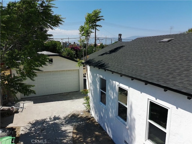 817 Orange Grove Ave, Colton, CA 92324 - view of home's exterior with roof with shingles, stucco siding, and an outbuilding