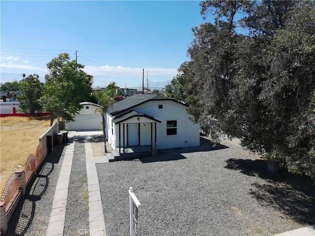 817 Orange Grove Ave, Colton, CA 92324 - view of side of property featuring an outbuilding and stucco siding