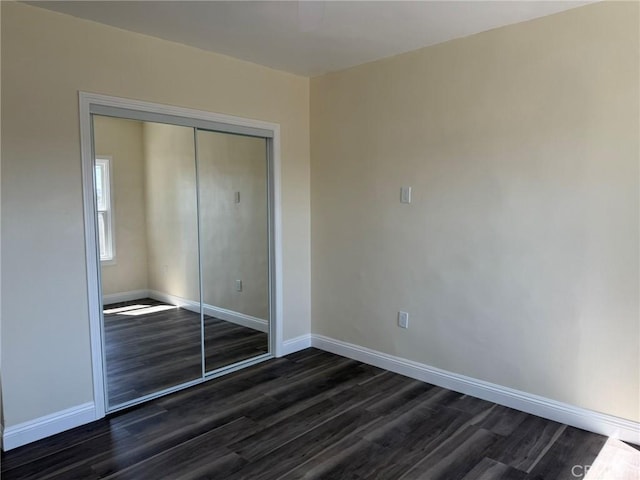 817 Orange Grove Ave, Colton, CA 92324 - unfurnished bedroom featuring dark wood-style floors and a closet