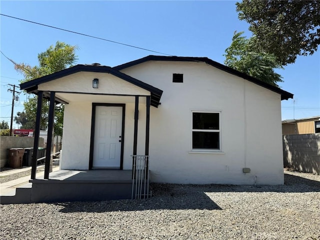 817 Orange Grove Ave, Colton, CA 92324 - view of front of home with stucco siding and covered porch