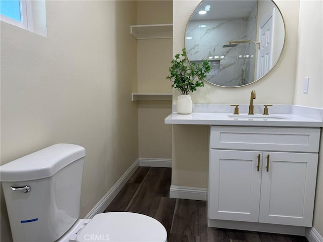 817 Orange Grove Ave, Colton, CA 92324 - bathroom featuring vanity, a marble finish shower, and wood finished floors