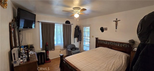 6718 Del Rosa Dr, San Bernardino, CA 92404 - bedroom with wood finished floors and ceiling fan