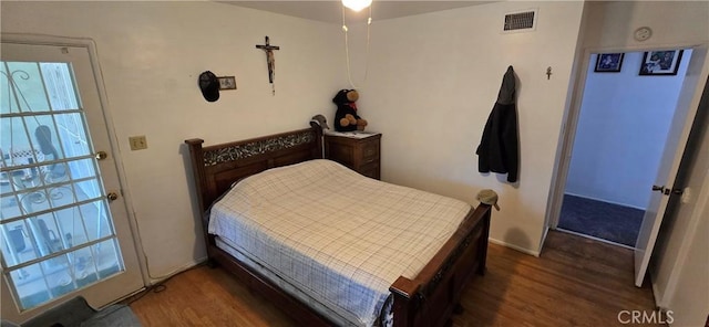 6718 Del Rosa Dr, San Bernardino, CA 92404 - bedroom featuring wood finished floors and multiple windows