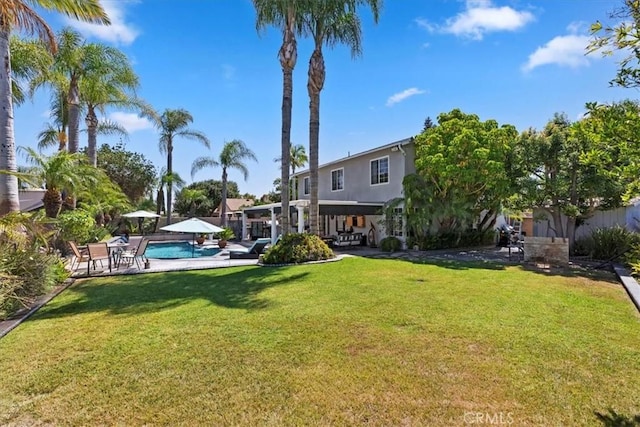 1110 Norcrest St, Corona, CA 92878 - view of grassy yard with a patio and an outdoor pool
