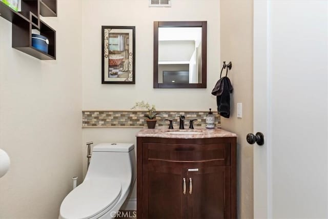 1110 Norcrest St, Corona, CA 92878 - half bathroom featuring vanity and tasteful backsplash