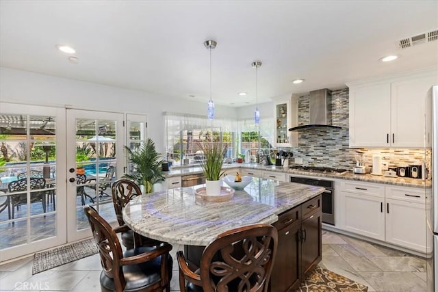 1110 Norcrest St, Corona, CA 92878 - kitchen with wall chimney range hood, appliances with stainless steel finishes, healthy amount of natural light, a kitchen bar, and recessed lighting