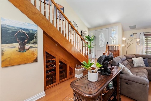 1110 Norcrest St, Corona, CA 92878 - living room with light wood-type flooring, stairway, and vaulted ceiling