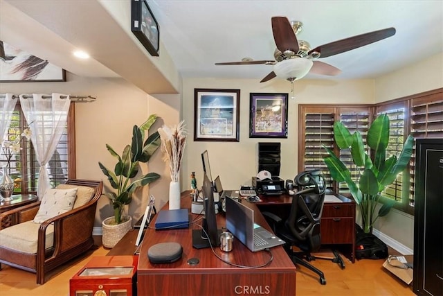 1110 Norcrest St, Corona, CA 92878 - home office featuring a ceiling fan, plenty of natural light, and wood finished floors