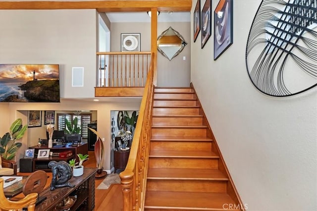 1110 Norcrest St, Corona, CA 92878 - stairway featuring a high ceiling and wood finished floors