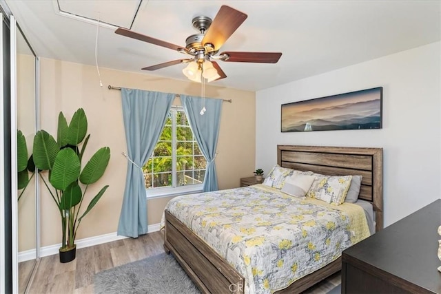 1110 Norcrest St, Corona, CA 92878 - bedroom featuring attic access, wood finished floors, and a ceiling fan