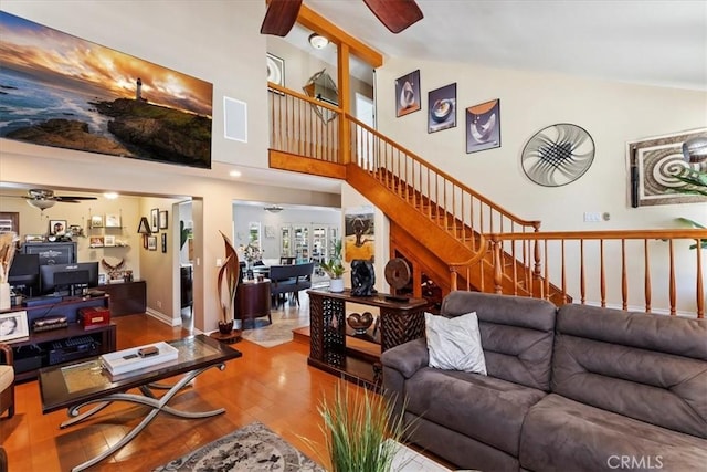 1110 Norcrest St, Corona, CA 92878 - living room featuring ceiling fan, wood finished floors, high vaulted ceiling, and stairway