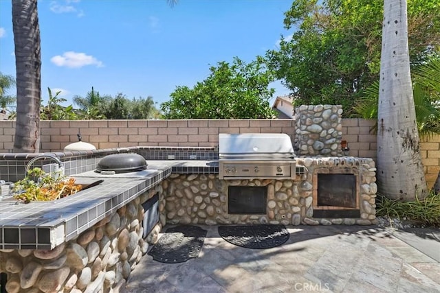 1110 Norcrest St, Corona, CA 92878 - view of patio / terrace with an outdoor kitchen