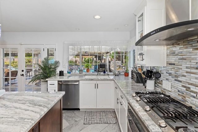 1110 Norcrest St, Corona, CA 92878 - kitchen with wall chimney range hood, appliances with stainless steel finishes, decorative backsplash, light stone countertops, and recessed lighting