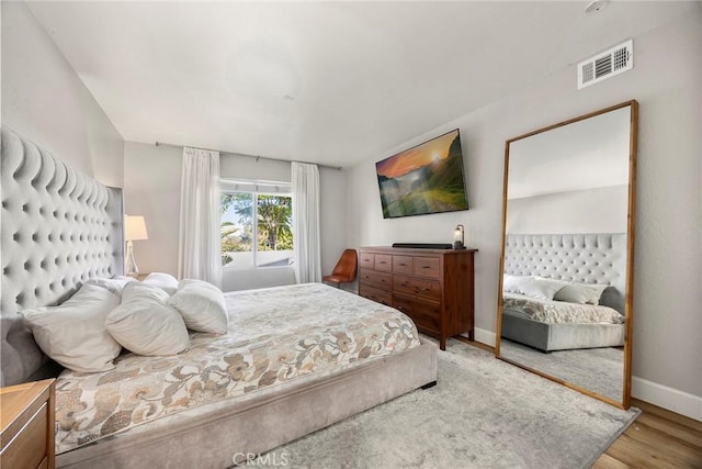 26925 Jasper Unit 210, Mission Viejo, CA 92691 - bedroom featuring baseboards and wood finished floors