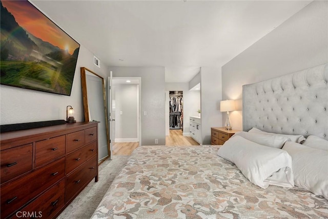 26925 Jasper Unit 210, Mission Viejo, CA 92691 - bedroom with a spacious closet, light carpet, and a closet